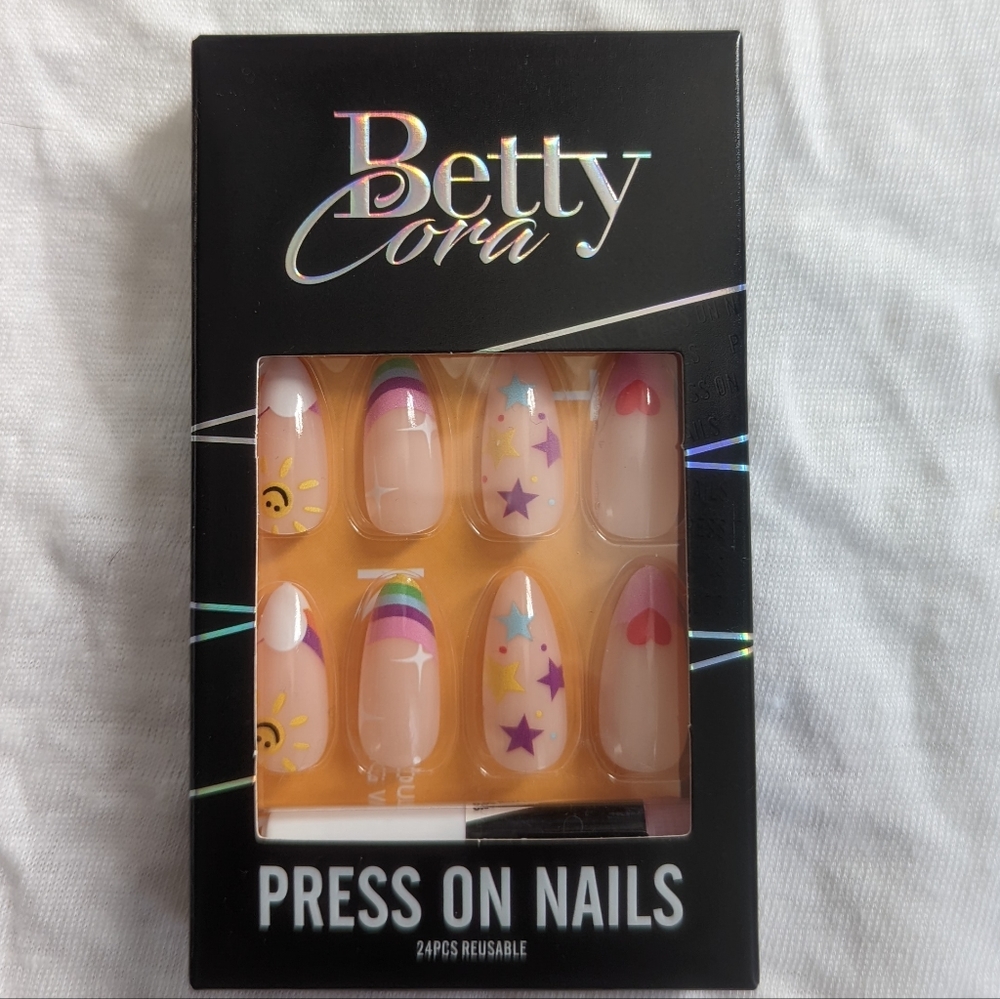 Bettycora medium length almond shaped press on nails in cartoon cloud print